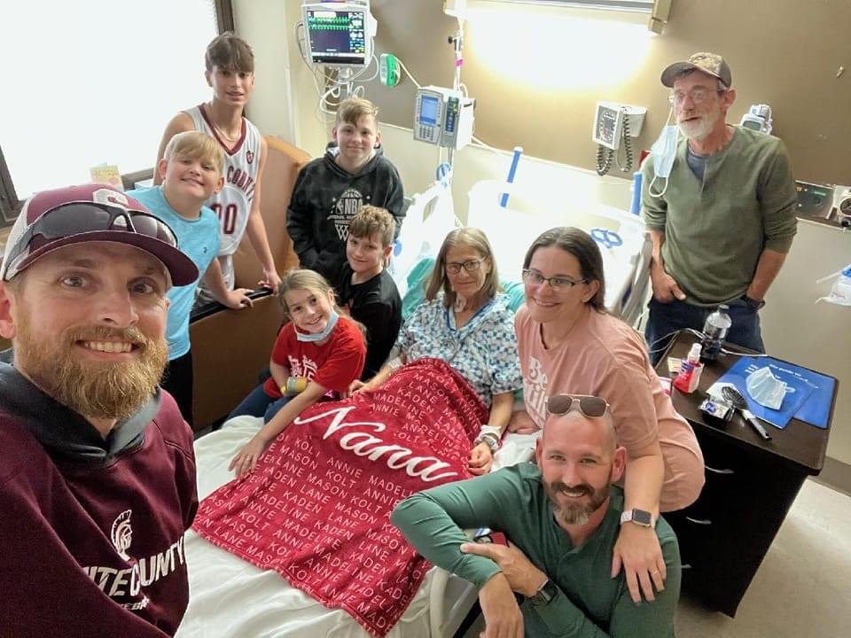 Pat Seibers is surrounded by family before her surgery - notice that Wayne is in this photo along with all their grandchildren and Melony and Tim. Wayne’s heart attack would occur only a few days later.